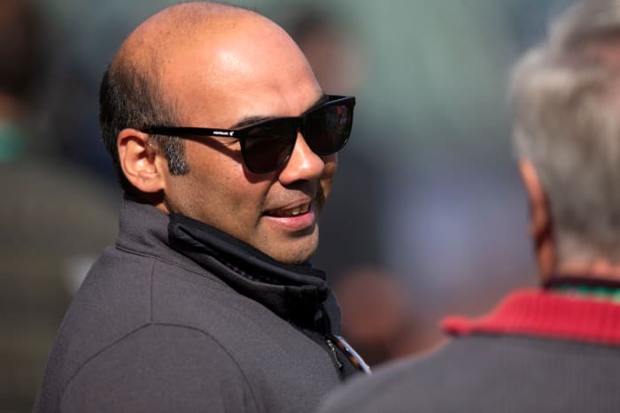 SF Giants president of baseball operations Farhan Zaidi talks with a reporter prior to a game in the 2021 NLDS.